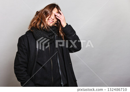 Handsome fashion man portrait wearing black coat. 132486710