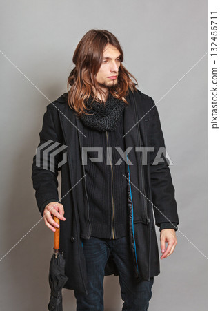 Handsome fashion man portrait wearing black coat. 132486711