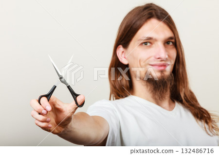 Hairstylist with scissors in hand Hairstylist with scissors in hand 132486716