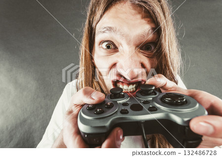 Stressed man playing on pad Stressed man playing on pad 132486728