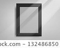 Black photo frame on bright wall with sun beam. 3d vector mockup 132486850