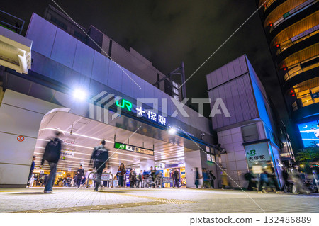 Tokyo cityscape in Japan. View of Otsuka Station at night. Many people coming and going. Tokyo cityscape in Japan. View of Otsuka Station at night. Many people coming and going. 132486889