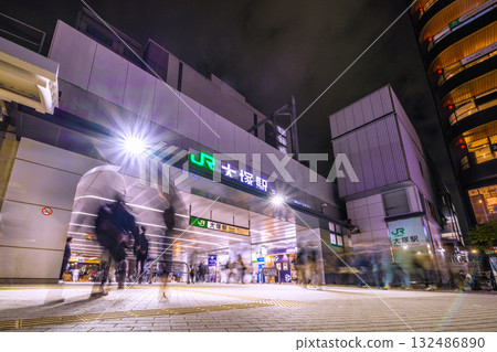 Tokyo cityscape in Japan. View of Otsuka Station at night. Many people coming and going. 132486890