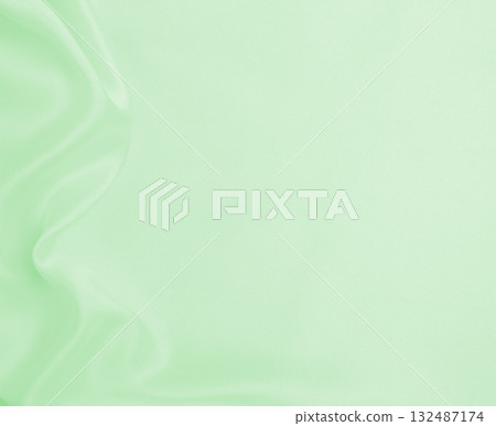Smooth elegant green silk or satin luxury cloth texture as abstract background. Luxurious background design 132487174