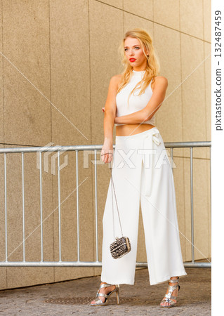 Woman wearing crop top and culottes Woman wearing crop top and culottes 132487459