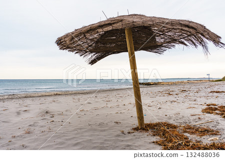 Shelter on beach. Cloudy weather 132488036