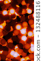 Cluster of glowing red and orange spheres with light cores on dark background 132488116