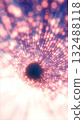 Bright glowing tunnel of pink and violet light dots radiating into a dark circular void 132488118