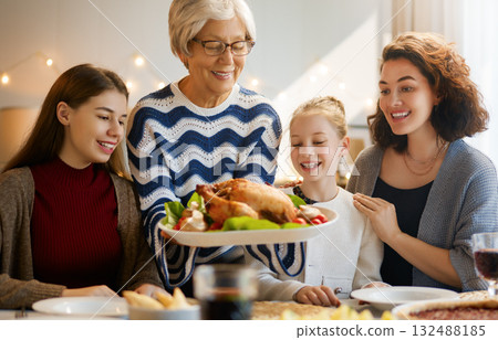 Family celebrating Thanksgiving Day Family celebrating Thanksgiving Day 132488185