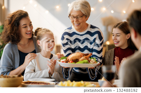 Family celebrating Thanksgiving Day 132488192
