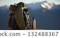 Backpack and water bottle on mountain top during hiking adventure 132488367