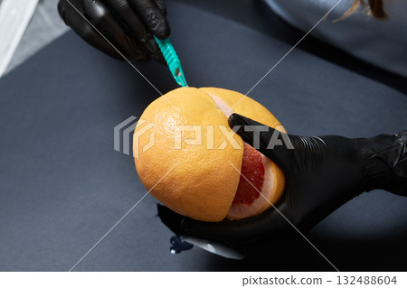 Food testing in the laboratory. The lab technician prepares a sample for microscopic examination. 132488604