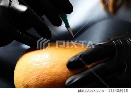 Food testing in the laboratory. The lab technician prepares a sample for microscopic examination. 132488618