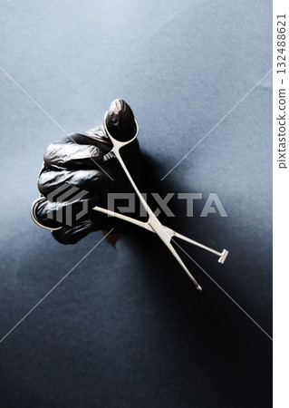 hand-held stainless steel surgical scissors with gloves. hand-held stainless steel surgical scissors with gloves. 132488621