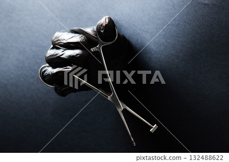 hand-held stainless steel surgical scissors with gloves. hand-held stainless steel surgical scissors with gloves. 132488622