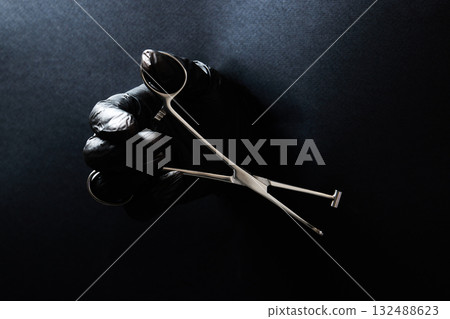 hand-held stainless steel surgical scissors with gloves. hand-held stainless steel surgical scissors with gloves. 132488623