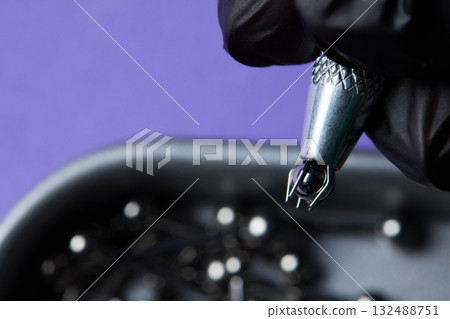 Piercing earrings close-up. On a black background. 132488751