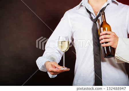 Waiter serving wine bottle. 132488947