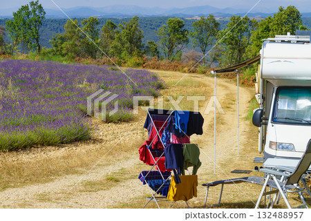 Clothes hanging to dry outdoors by camping car. Caravan vacation in France Clothes hanging to dry outdoors by camping car. Caravan vacation in France 132488957