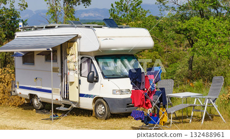 Clothes hanging to dry outdoors by camping car. Caravan vacation. Clothes hanging to dry outdoors by camping car. Caravan vacation. 132488961