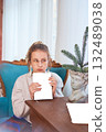 teenage girl reading a book sitting in an armchair, mockup 132489038