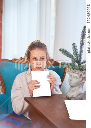 teenage girl reading a book sitting in an armchair, mockup 132489038