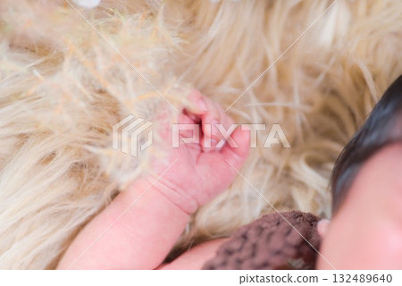 The warmth and moments of life conveyed by a newborn's tiny hands The warmth and moments of life conveyed by a newborn's tiny hands 132489640