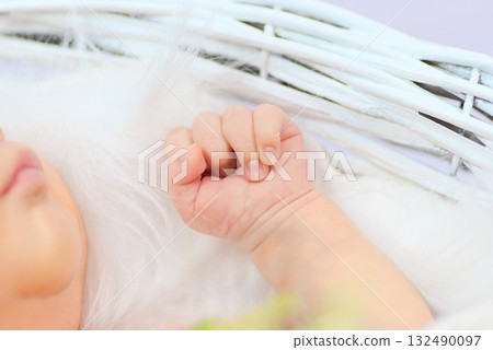 The comfort and hope for the future that a newborn's tiny hands hold 132490097