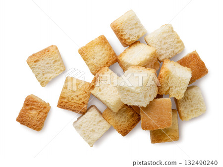 Pile of bread croutons on a white background. Top view Pile of bread croutons on a white background. Top view 132490240