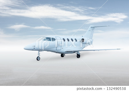 Modern white private jet isolated on bright background with sky 132490538