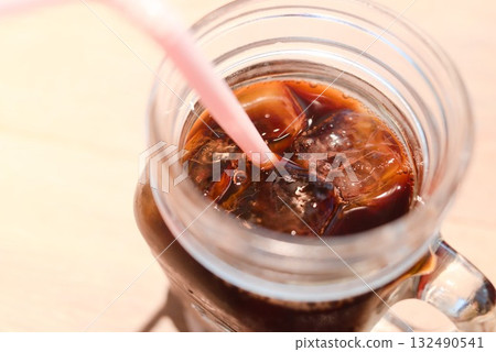 A mug of iced coffee with clear, sparkling ice 132490541