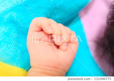 Close-up of a baby's hand - A moment of feeling tenderness and warmth - 132490775