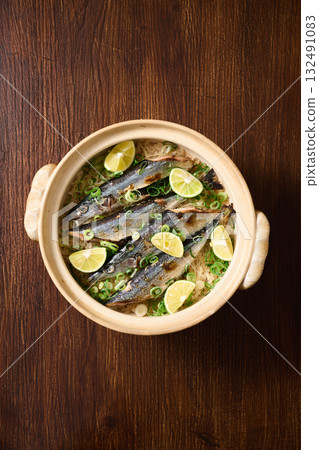 Sanma rice cooked in a clay pot 132491083