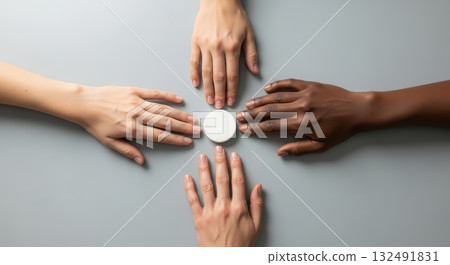 Diverse hands reaching towards the center, symbolizing unity, cooperation, and human diversity. 132491831
