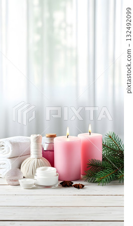 Vertical holiday spa scene with soft light, spa accessories and pine decorations. Copy space Vertical holiday spa scene with soft light, spa accessories and pine decorations. Copy space 132492099