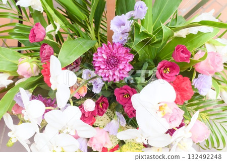 A gorgeous flower arrangement centered around Phalaenopsis and dahlias A gorgeous flower arrangement centered around Phalaenopsis and dahlias 132492248