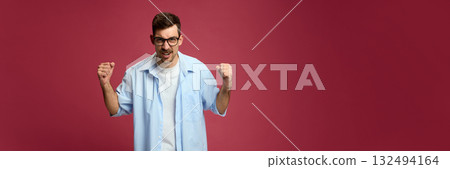 Happy man clenching fists in excitement expressing victory and joy. Banner Happy man clenching fists in excitement expressing victory and joy. Banner 132494164