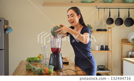 Photo set of a woman making a fruit smoothie in her home kitchen, reflecting a healthy and balanced daily lifestyle Photo set of a woman making a fruit smoothie in her home kitchen, reflecting a healthy and balanced daily lifestyle 132494716