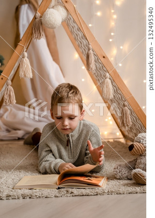 Child Reading a Book Inside Cozy Tent Child Reading a Book Inside Cozy Tent 132495340