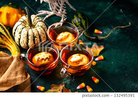 Haloween spicy apple cider drink Haloween spicy apple cider drink 132495391
