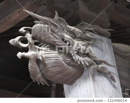 A dynamic wooden dragon carving decorates the main building of Mitake Shrine A dynamic wooden dragon carving decorates the main building of Mitake Shrine 132496014