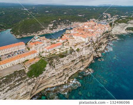 Aerial view marina cape Bonifacio south Corsica France citadel on rocky promontory on wild white limestone cliffs 132496096