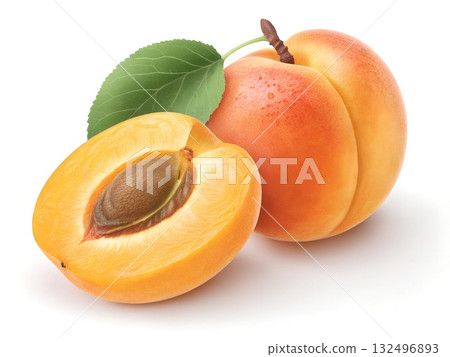Two ripe apricots one whole and one halved revealing its seed with a green leaf on a white background Two ripe apricots one whole and one halved revealing its seed with a green leaf on a white background 132496893