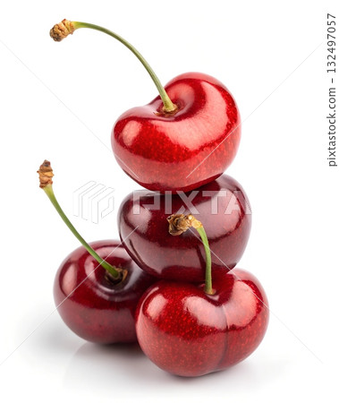 Stacked red cherries with green stems on a white background Fruit Healthy Eating 132497057