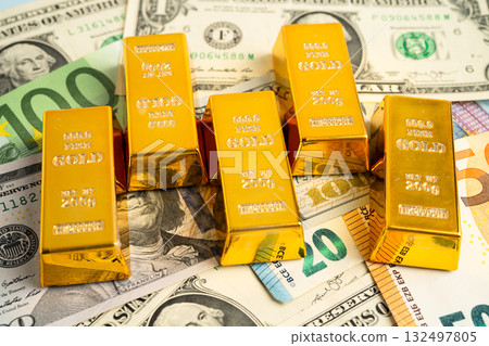 Gold bars on US dollar banknote money, finance trading investment business currency. Gold bars on US dollar banknote money, finance trading investment business currency. 132497805