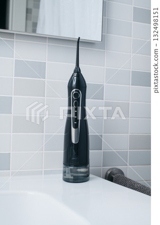closeup of an oral irrigator in a bathroom closeup of an oral irrigator in a bathroom 132498151