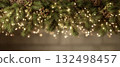 Christmas pine branches with lights and pinecones 132498457