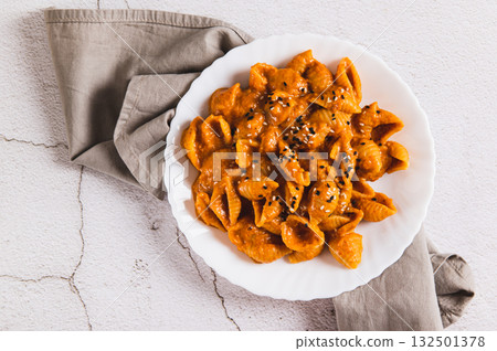 Close up of spicy miso pasta shells on a plate on the table top view 132501378