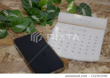 May 2026 calendar material: Fabric calendar and wood grain background 132501440