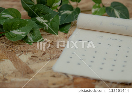 May 2026 calendar material: Fabric calendar and wood grain background 132501444